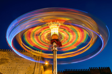 Motion blur of spinning machine in amusement park