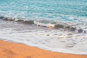 Soft sea wave on sandy shore