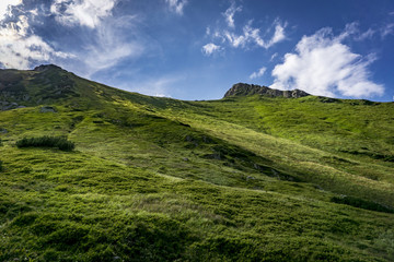 Obraz na płótnie Canvas Summer landscape of green hills against the blue sky. Belianske Tatry Mountains Slovakia.