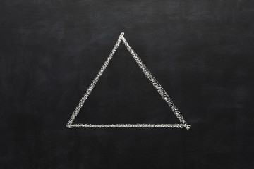 Triangle drawn with chalk on blackboard