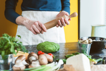 Chef cook step by step makes green ravioli in the shape of a heart for a festive dinner