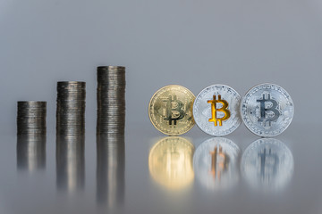 Stacks of silver coins on the table with the Bitcoins. BTC. Internet currency. Business concept