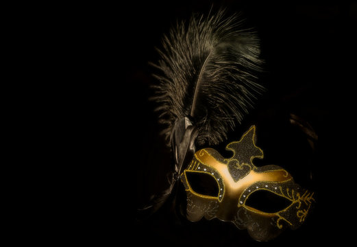 gold mask on black background