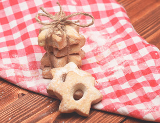 Tea cookies on wooden background. Composition of tiny gateau
