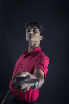 Armed robber pointing a weapon to the camera