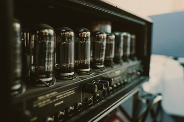 close-up shot of sound amplifier with lamps at recording studio
