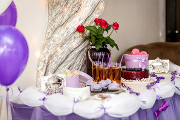 candy bar decorated by delicious sweet buffet with cupcakes and other desserts/candies,happy birthday concept