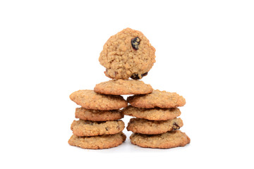 Fresh baked oatmeal cookies stacked isolated white background