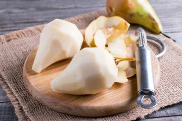 Peeled pears on a cutting board