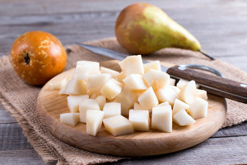 Cubes of pears on a cutting board on a table