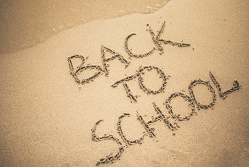 Back to School text written on sand