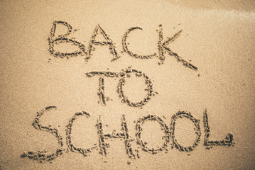 Back to School text written on sand