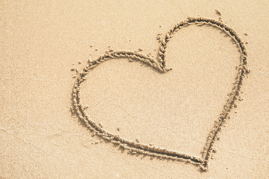 Heart written on the sand