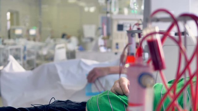 A focused view on a dialysis machine in a hospital ward. 