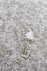 Footprint on snow in Chicago city, winter in December, cold weather outside.