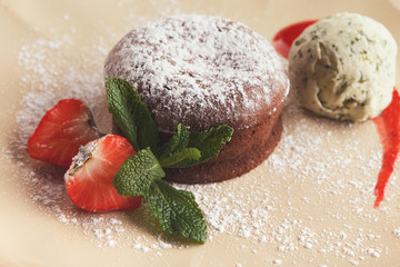 Chocolate fondant with vanilla ice cream and strawberry