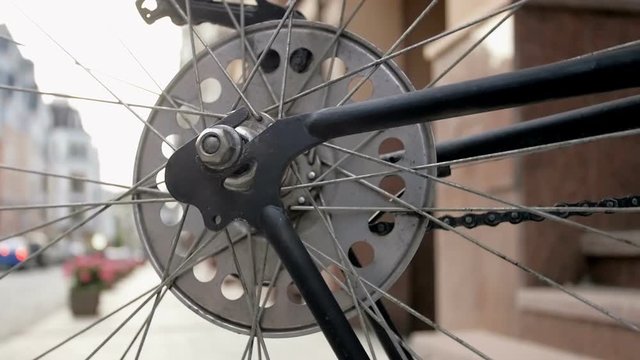 Closeup toned footage of spinning wheel of old bicycle