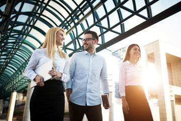 Picture of young attractive business partners standing