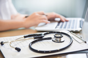 Stethoscope on a clipboard.