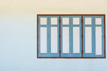 Retro wooden window on walls of the house with space. use for background.