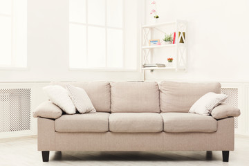 Beige couch on white window background