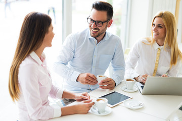 Fototapeta premium Happy colleagues casual chat at the office