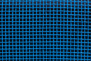 Cell a blue grid. Blue background. Painted metal surface. Texture ventilation grid as a background...