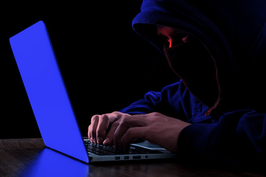 Anonymous hacker in the dark