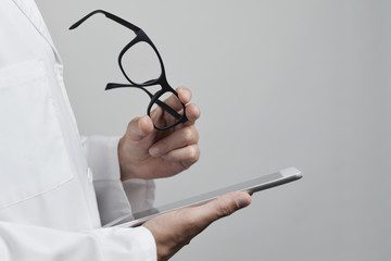 optician man checking a tablet