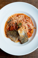 Grilled sea bass and spaghetti with tomato sauce
