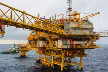 Offshore oil and Gas central processing platform and remote platform produced oil, natural gas and liquid condensate for set to onshore refinery from offshore in ocean sea and along with supply boat.
