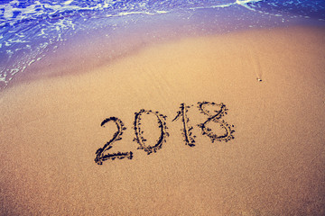 inscription 2018 on the beach