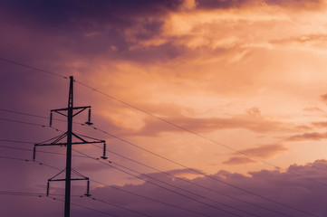 Electric pole on the background of the setting sun.