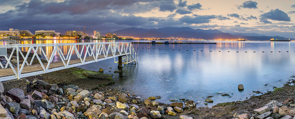 Obraz na płótnie Canvas Nocturnal panoramic view on the central public beach of Eilat - famous resort and recreational city in Israel