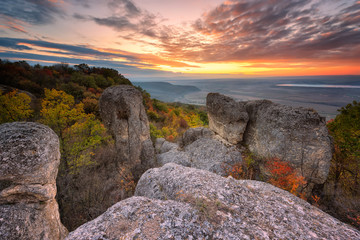 Autumn sunset /
Magnificent view from a hill with an autumn forest at sunset