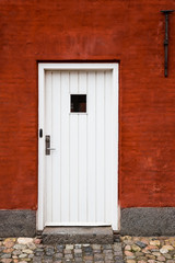 White Entry Door in Red Brick Building, Close Up, Exterior, Europe