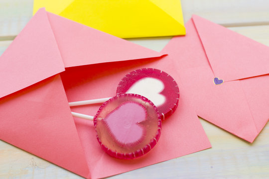 Pink envelopes and candies