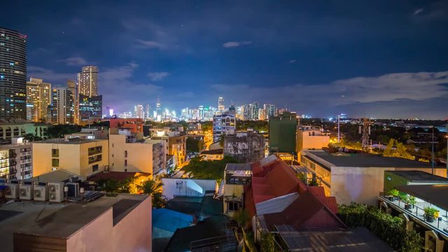Time lapse view of Makati skyscrapers in Manila city. Skyline at night, Philippines.