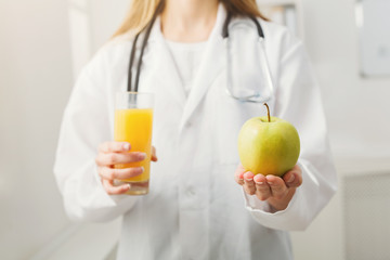 Unrecognizable nutritionist woman with fruit