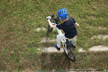 Child getting ready to go for a bike ride