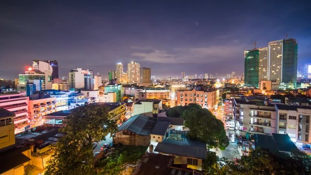 Time lapse view of Makati skyscrapers in Manila city. Skyline at night, Philippines.