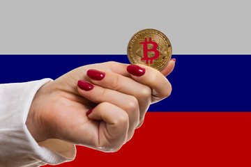 Female hand holds bitcoin isolate bitcoins and new virtual money concept