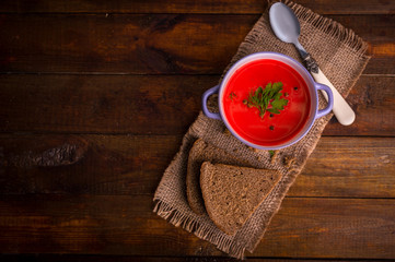Tomato soup on a wooden table