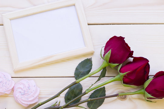 Red roses, marshmellows and photo frame