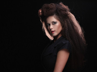 Fototapeta na wymiar Beautiful young woman with magnificent hairdo