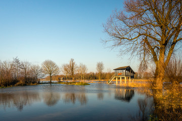 Birdwatching hut in a flooded Dutch nature reserve