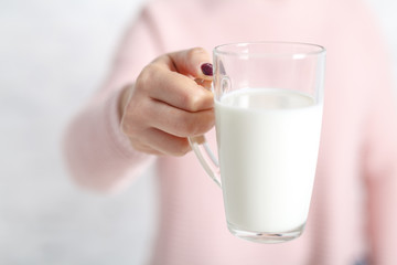 woman ready to drink a mug of milk