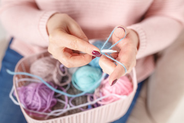 Knitting concept< female hands with color clew ball