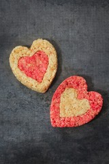 Fototapeta premium Homemade Rice Crispy hearts with copy space / valentines day food top view
