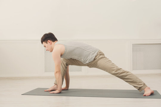 Fitness man plank training indoors